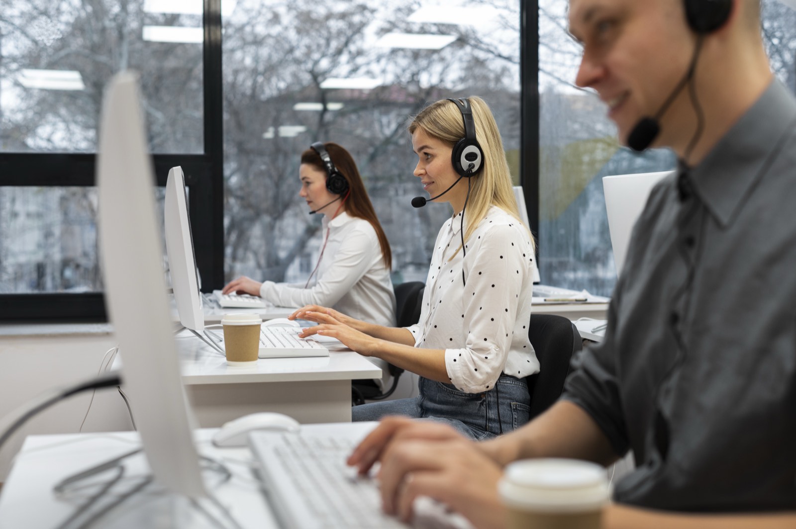Interviewers working together in a call centre